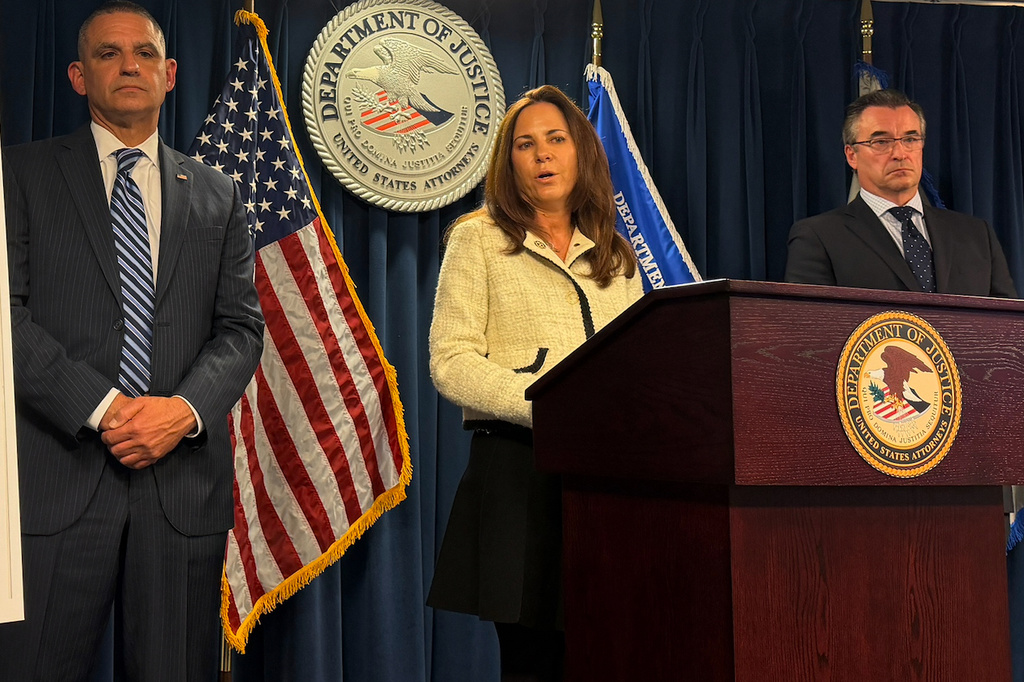 U.S. Attorney Leah Foley is joined by John Soars, assistant special agent in charge Homeland Security Investigations in New England and Shawn Saucier, Northeast Regional Chief, U.S. Citizenship and Immigration Services, to announce the arrest of six people for allegedly arranging sham marriages over the past decade that netted them millions of dollars during a news conference on Wednesday, Oct. 21, 2025 in Boston. (AP Photo/Michael Casey)
