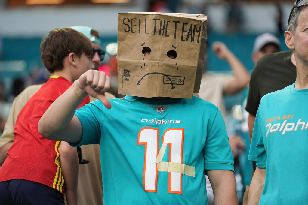 A fan shows his frustration with the Miami Dolphins following an NFL football game against the Cincinnati Bengals, Sunday, Dec. 21, 2025, in Miami Gardens, Fla. (AP Photo/Lynne Sladky)