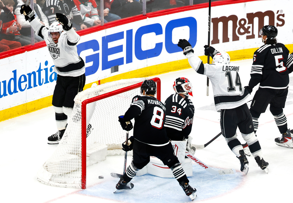 New Jersey Devils goaltender Jake Allen (34) reacts after goal by Los Angeles Kings center Anze Kopitar, left, during the third period of an NHL hockey game, Saturday, March 14, 2026, in Newark, N.J. (AP Photo/Noah K. Murray)