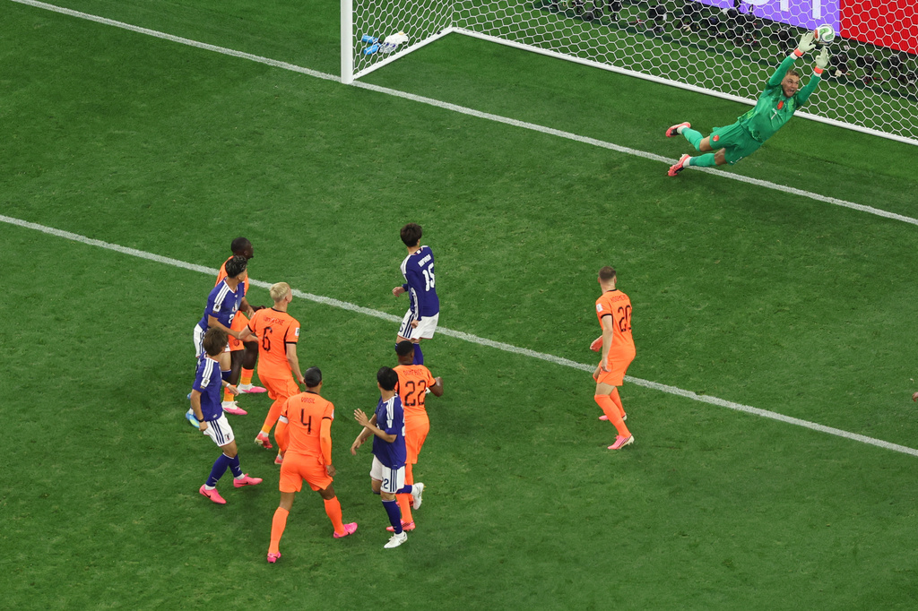 Netherlands goalkeeper Bart Verbruggen (1) gives up a goal to Japan's Daichi Kamada (15) during the World Cup Group F soccer match between the Netherlands and Japan in Arlington, Texas, near Dallas, Sunday, June 14, 2026. (AP Photo/Sam Hodde)