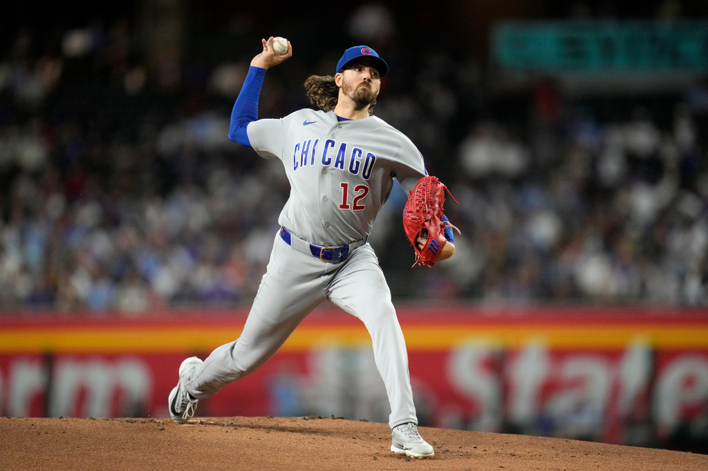 Chicago Cubs starting pitcher Kevin Gausman throws against the Arizona Diamondbacks during the first inning of a baseball game, Monday, Aug. 24, 2026, in Phoenix. (AP Photo/Ross D. Franklin)