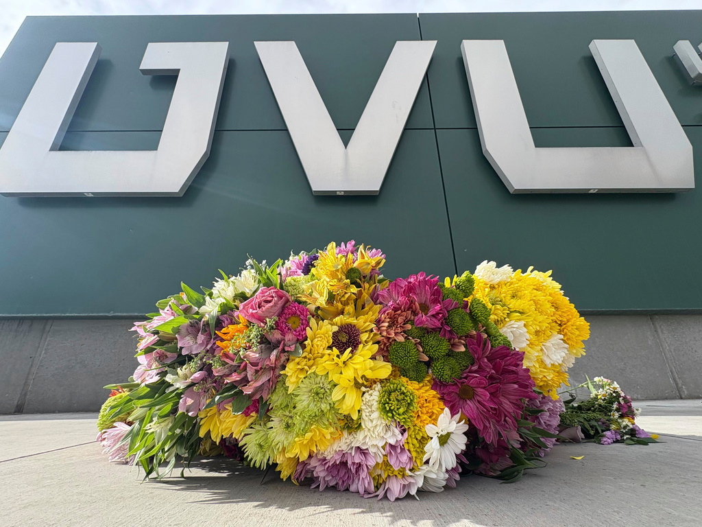 Flowers are shown at the Keller Building on the Utah Valley University campus after Charlie Kirk was shot and died during Turning Point's visit to the university, Wednesday, Sept. 10, 2025, in Orem, Utah. (AP Photo/Hannah Schoenbaum)
