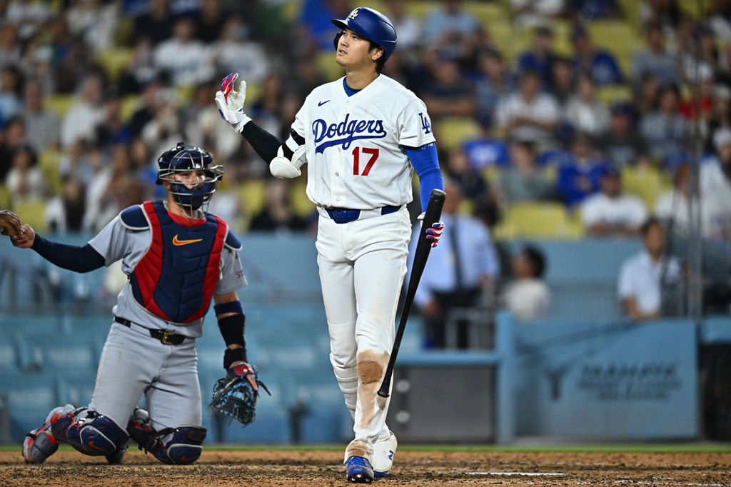 Los Angeles Dodgers' Shohei Ohtani (17) reacts after taking a strike during the 10th inning of a baseball game against the St. Louis Cardinals, Wednesday, Sept. 2, 2026, in Los Angeles. (AP Photo/William Liang)