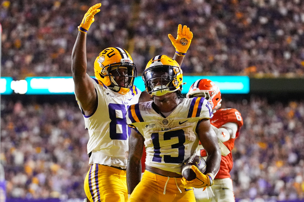 LSU running back Dilin Jones (13) celebrates his touchdown against Clemson in the second half of an NCAA college football game, Saturday, Sept. 5, 2026 in Baton Rouge, La. (AP Photo/Gerald Herbert)