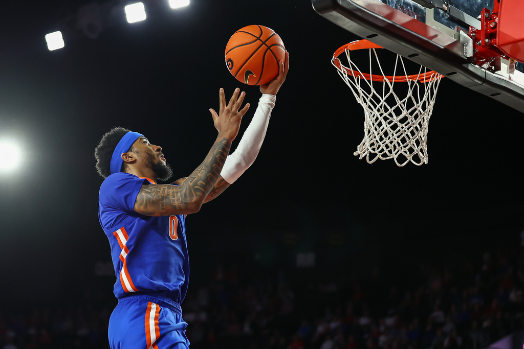 Florida guard Boogie Fland (0) shoots during the second half of an NCAA college basketball game against Georgia, Wednesday, Feb. 11, 2026, in Athens, Ga. (AP Photo/Colin Hubbard)