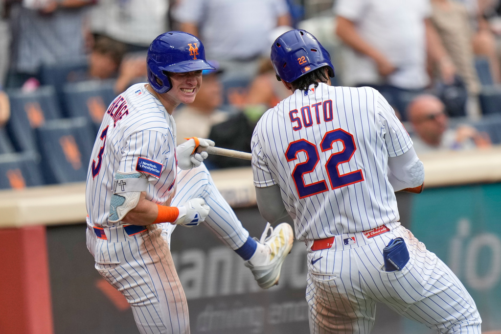 New York Mets' Juan Soto, right, celebrates his solo home run with Carson Benge during the seventh inning of a baseball game against the Kansas City Royals, Thursday, July 9, 2026, in New York. (AP Photo/Seth Wenig)