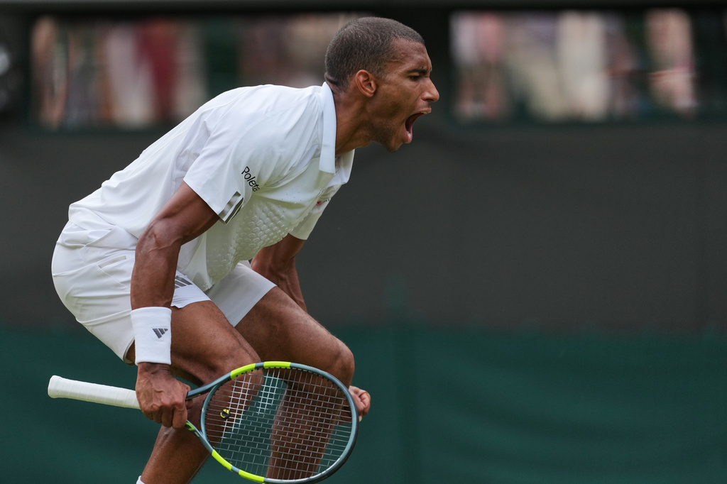 Felix Auger-Aliassime of Canada celebrates winning the men's singles fourth round match against Alejandro Davidovich Fokina of Spain at the Wimbledon Tennis Championships in London, Sunday, July 5, 2026.(AP Photo/Kin Cheung)