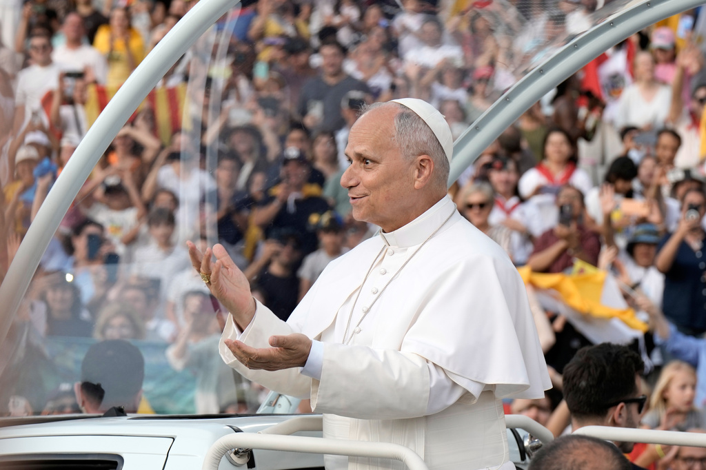 Pope Leo XIV makes a six-seven hand gestures as he arrives to attend a prayer vigil at Lluis Companys Olympic Stadium in Barcelona, Spain, Tuesday, June 9, 2026. (AP Photo/Bernat Armangue)