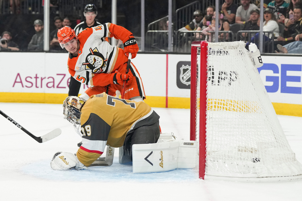Anaheim Ducks right wing Beckett Sennecke (45) scores against Vegas Golden Knights goaltender Carter Hart (79) during the first period of Game 5 of a second-round NHL hockey Stanley Cup playoff series Tuesday, May 12, 2026, in Las Vegas. (AP Photo/Candice Ward)