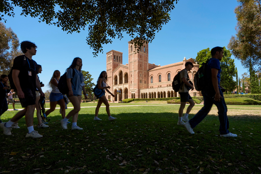 FILE - Students walk past Royce Hall on the UCLA campus in Los Angeles, Aug. 15, 2024. (AP Photo/Damian Dovarganes, File)