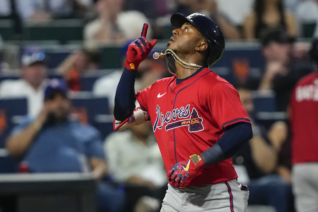 Atlanta Braves' Ozzie Albies celebrates after hitting a home run during the fourth inning of a baseball game against the New York Mets, Thursday, Aug. 14, 2025, in New York. (AP Photo/Yuki Iwamura)