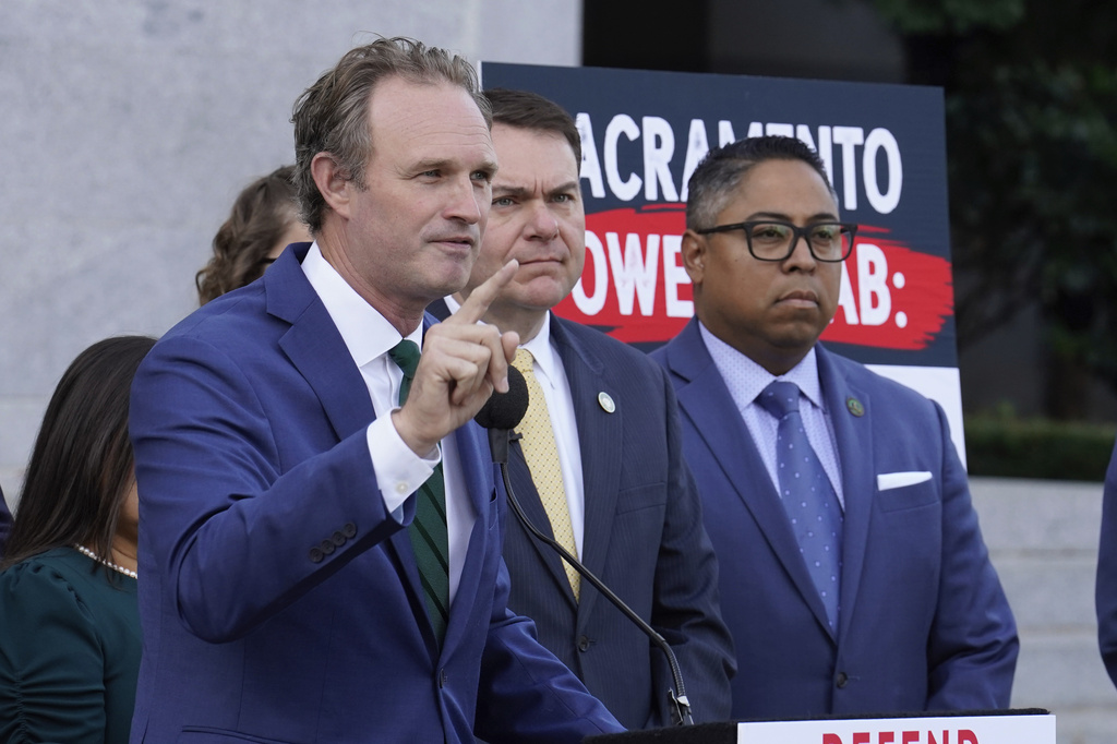 California state Assembly Republican leader James Gallagher of Yuba City, left, speaks against a package of measures to redraw the state's Congressional districts and put new maps before voters in a special election, during a news conference in Sacramento, Calif., Thursday, Aug. 21, 2025. (AP Photo/Rich Pedroncelli)
