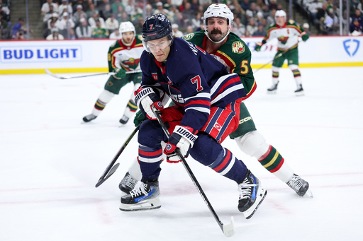 Winnipeg Jets center Vladislav Namestnikov (7) and Minnesota Wild defenseman Jake Middleton (5) compete for the puck during the second period of an NHL hockey game Tuesday, Oct. 28, 2025, in St. Paul, Minn. (AP Photo/Matt Krohn) Winnipeg Jets center Vladislav Namestnikov (7) and Minnesota Wild defenseman Jake Middleton (5) compete for the puck during the second period of an NHL hockey game Tuesday, Oct. 28, 2025, in St. Paul, Minn. (AP Photo/Matt Krohn)