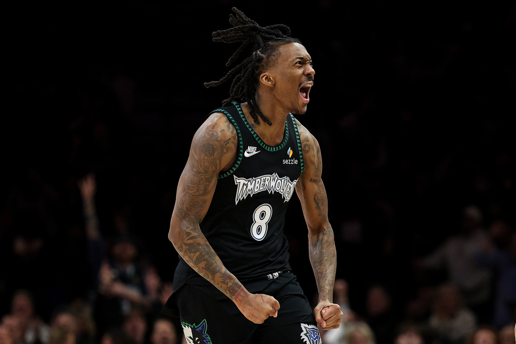 Minnesota Timberwolves guard Bones Hyland (8) celebrates his 3-point basket against the Oklahoma City Thunder during the first half of an NBA basketball game, Thursday, Jan. 29, 2026, in Minneapolis. (AP Photo/Matt Krohn)