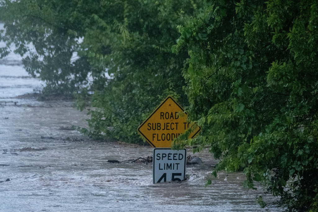 The Pedernales River floods along State Highway 16 on Thursday, July 16, 2026, in Fredericksburg, Texas. (AP Photo/Joel Angel Juarez)