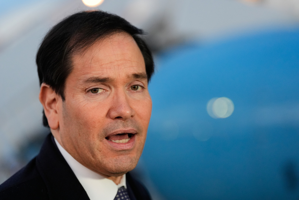 Secretary of State Marco Rubio speaks to reporters before boarding his plane, Thursday, Feb. 12, 2026, at Joint Base Andrews, Md., en route to the Munich Security Conference. (AP Photo/Alex Brandon, Pool)