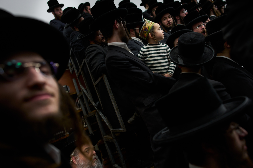 Ultra-Orthodox Jews from the Nadvorna Hasidic dynasty celebrate the Jewish holiday of Tu Bishvat, the "New Year of the Trees," in the ultra-Orthodox town of Bnei Brak, Israel, Monday, Feb. 2, 2026. (AP Photo/Oded Balilty)