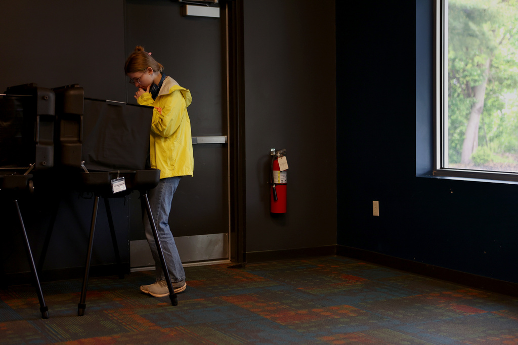 First-time voter Frida Webb casts a ballot in a polling location during a primary election on Tuesday, May 5, 2026, in West, Lafayette, Ind. (AP Photo/Cara Penquite)