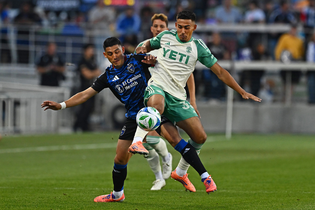 San Jose Earthquakes midfielder Cristian Espinoza (10) battles Austin FC midfielder Owen Wolff (33) for the ball during the first half of their decision match play at PayPal Park in San Jose, Calif., on Saturday, Oct. 18, 2025. (Jose Carlos Fajardo/Bay Area News Group via AP)