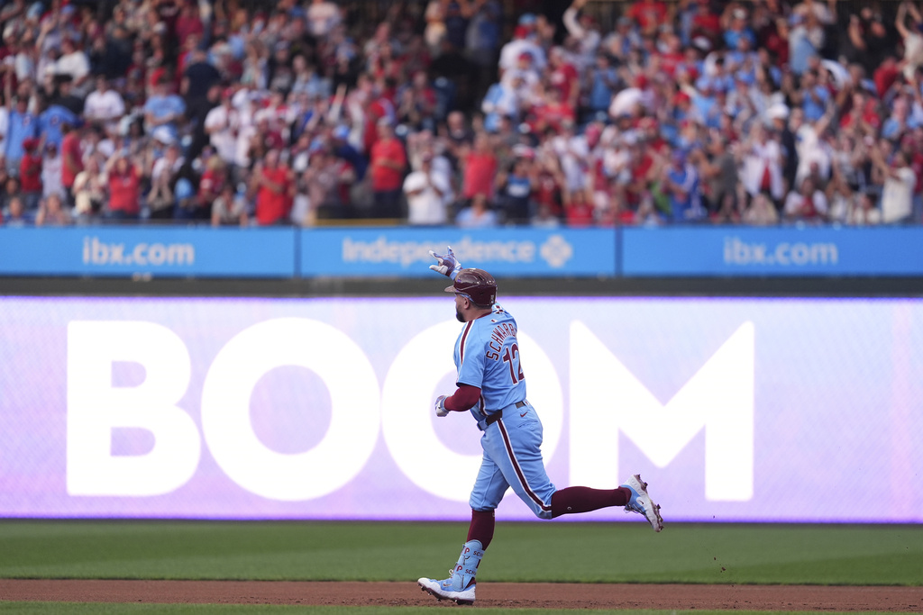 Philadelphia Phillies' Kyle Schwarber reacts after hitting a home run against Atlanta Braves pitcher Cal Quantrill during the first inning of a baseball game Thursday, Aug. 28, 2025, in Philadelphia. (AP Photo/Matt Slocum)