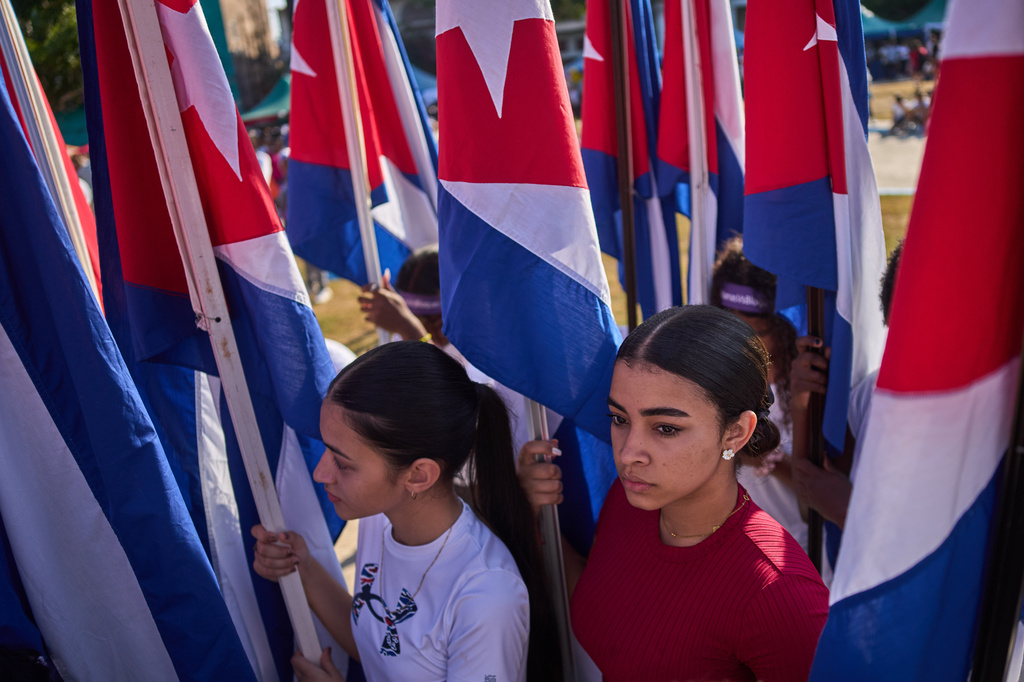 Women attend a rally calling for the end of the U.S. blockade against the island nation in Havana, Cuba, Tuesday, April 7, 2026. (AP Photo/Ramon Espinosa)
