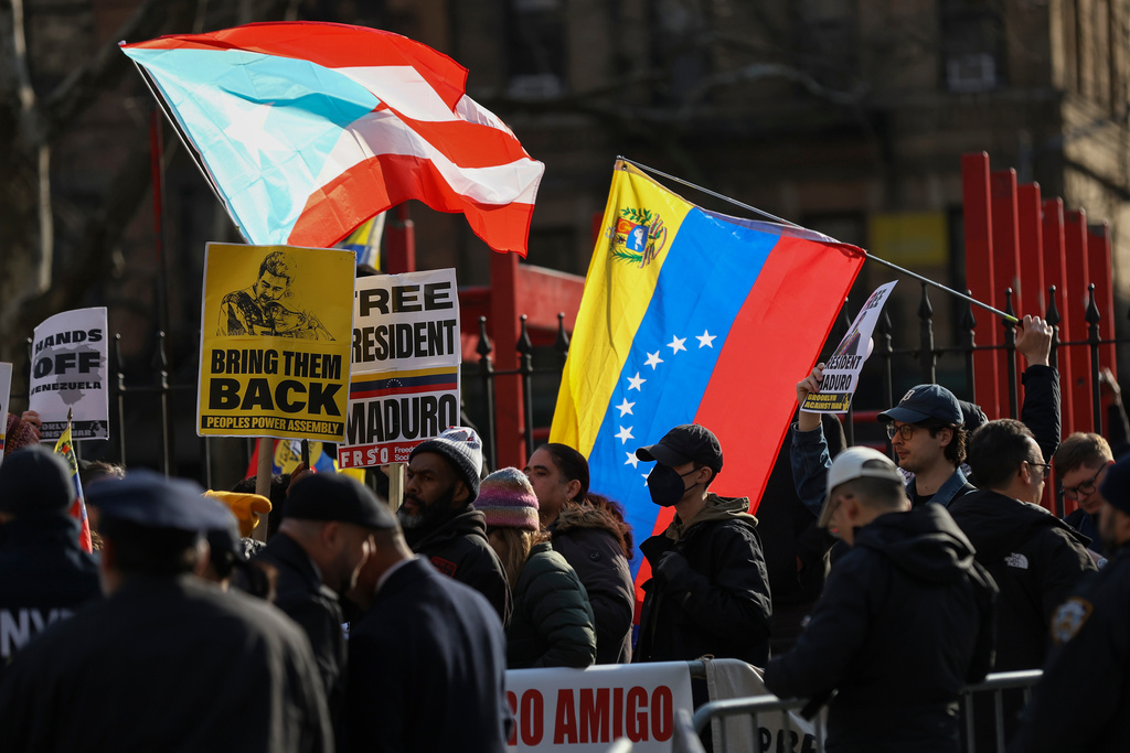 Demonstrators protest outside Manhattan federal court before a pre-trial hearing in former Venezuela President Nicolas Maduro's drug trafficking case, Thursday, March 26, 2026, in New York. (AP Photo/Heather Khalifa)
