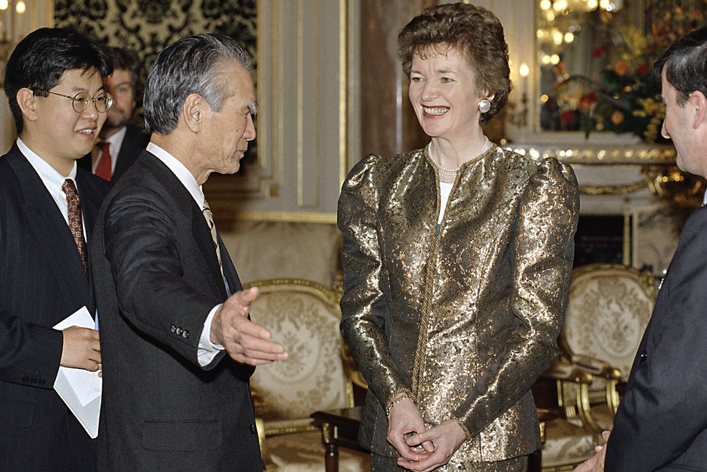 FILE - Irish President Mary Robinson, right, smiles at Japans Prime Minister Tomiichi Murayama, center left, prior to the dinner at the Akasaka Palace, Feb. 23, 1995, Tokyo, Japan. (AP Photo/Shizuo Kambayashi, File)