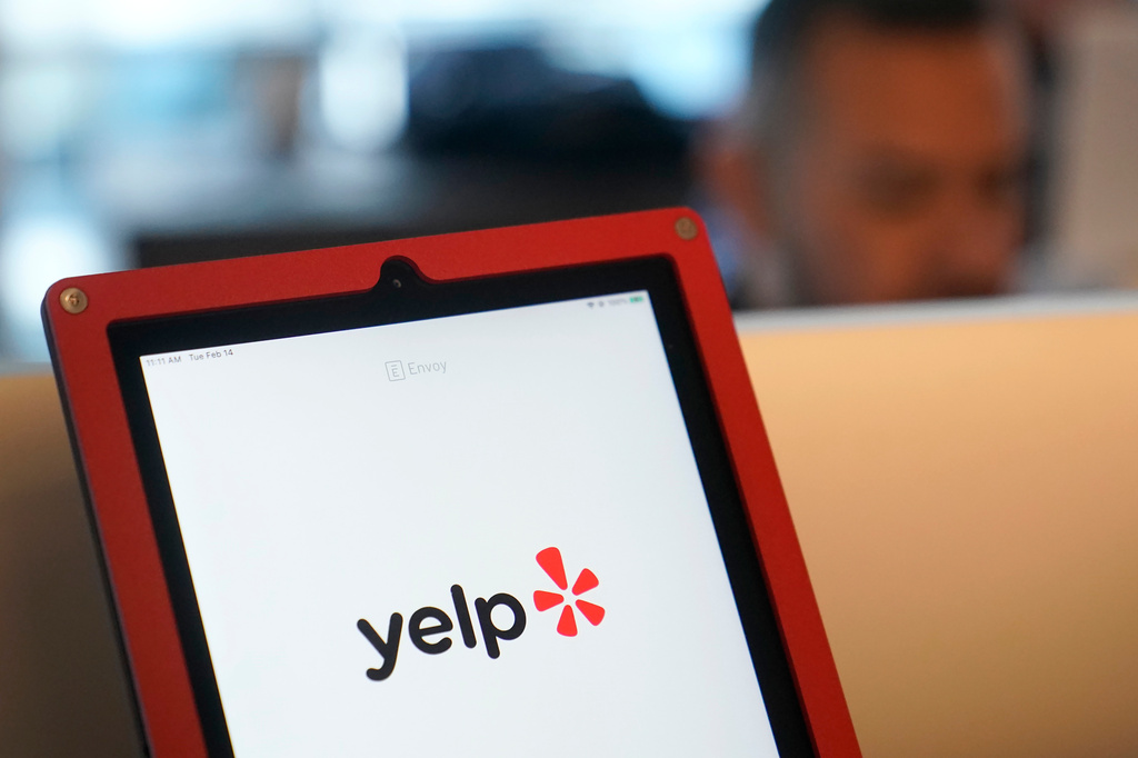 FILE - A Yelp logo is shown on a tablet at the company's office, in San Francisco, Feb. 14, 2023. (AP Photo/Jeff Chiu, File)