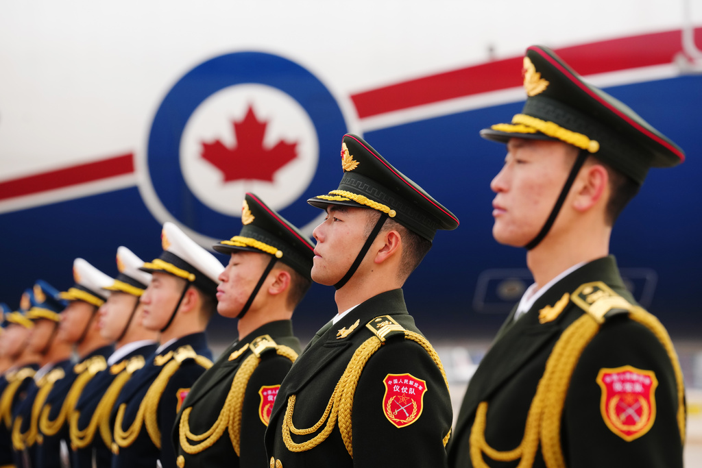A Chinese honour guard awaits the departure of Canada's Prime Minister Mark Carney at the airport in Beijing, China, Saturday, Jan. 17, 2026, on route to Doha, Qatar. (Sean Kilpatrick/The Canadian Press via AP)