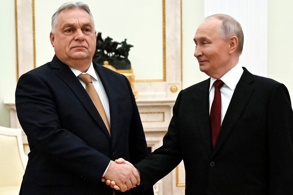 FILE - Russian President Vladimir Putin, right, and Hungarian Prime Minister Viktor Orban shake hands during their meeting at the Senate Palace of the Kremlin in Moscow, Russia, Nov. 28, 2025. (Alexander Nemenov/Pool Photo via AP, File)
