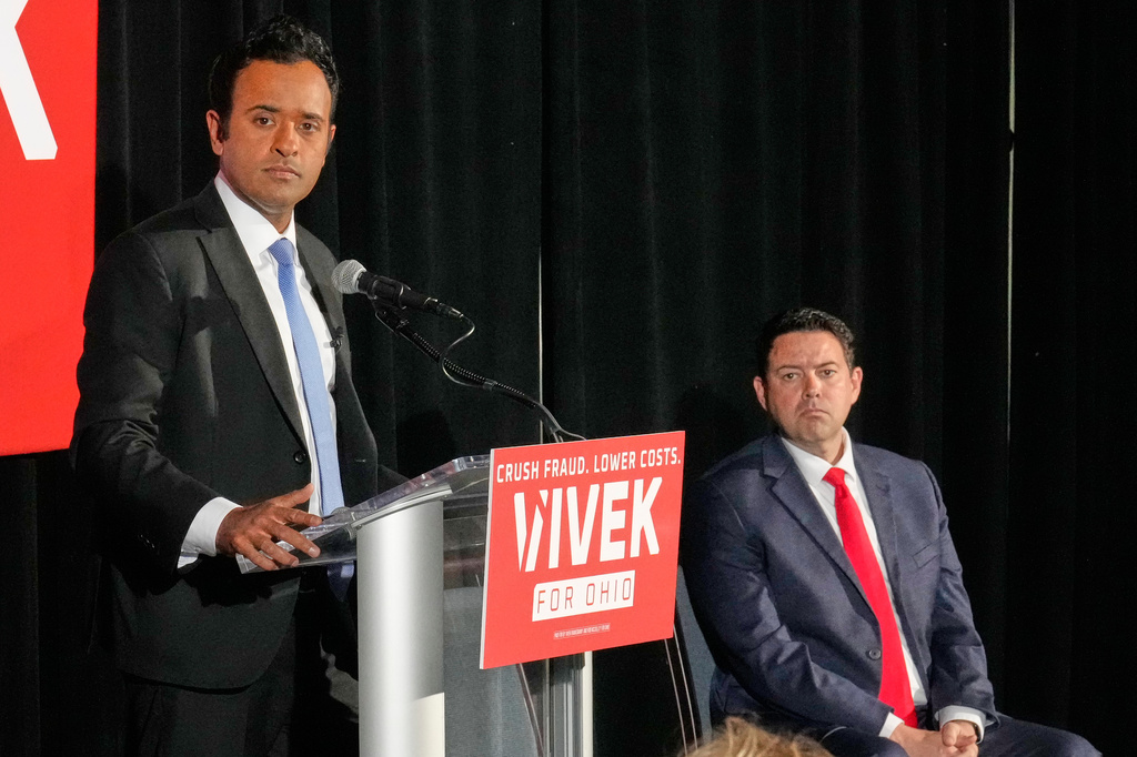Vivek Ramaswamy, left, candidate for Governor in Ohio, and his running mate, Ohio Senate President Rob McColley, right, listen to a question during a news conference on Medicaid fraud in Columbus, Ohio, Tuesday, May 19, 2026. (AP Photo/Sue Ogrocki)