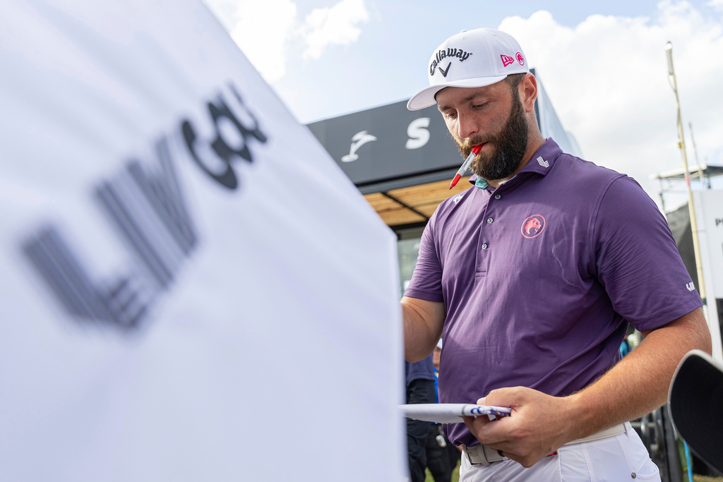 FILE - Captain Jon Rahm of Legion XIII signs autographs after the first round of LIV Golf tournament at Trump National Doral, April 4, 2025 in Miami. (Photo by Scott Taetsch/LIV Golf via AP, File)