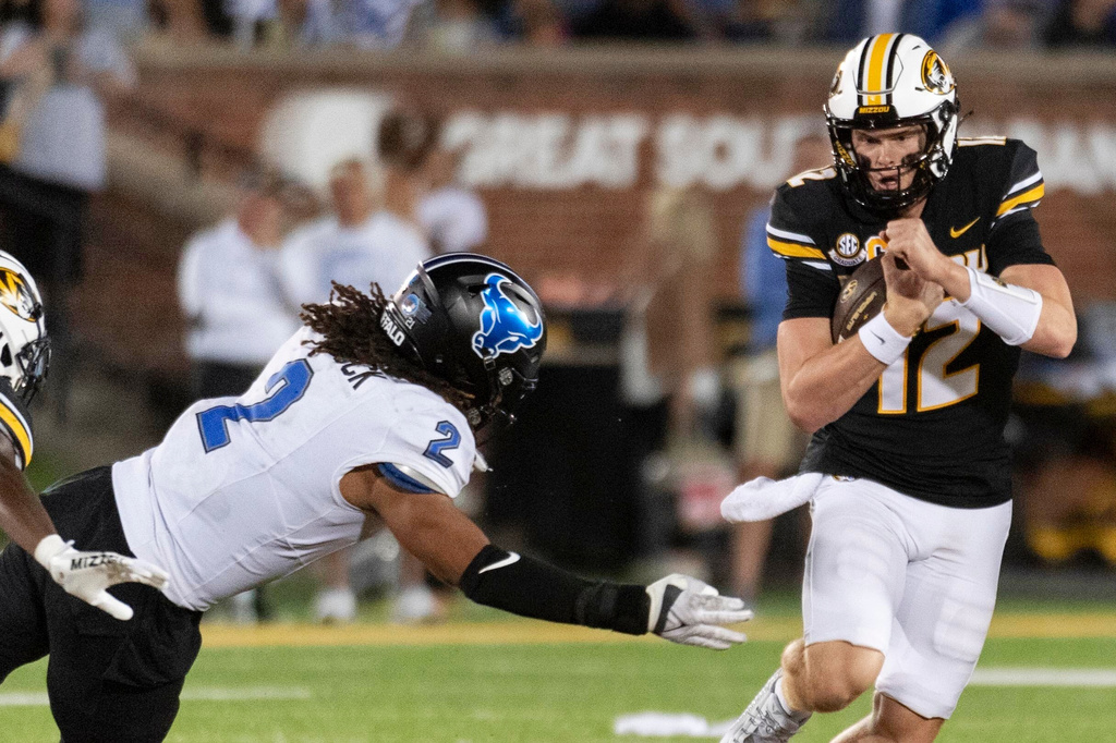 FILE - Buffalo's Red Murdock, left, tries to stop Missouri quarterback Brady Cook during the first half of an NCAA college football game Saturday, Sept. 7, 2024, in Columbia, Mo. (AP Photo/L.G. Patterson)