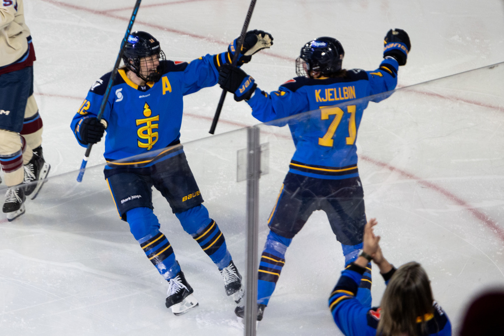 Toronto Sceptres' Anna Kjellbin (71) celebrates her goal against the Montreal Victoire with Allie Munroe (12) during the first period of a PWHL Takeover Tour game in Halifax, on Wednesday, Dec. 17, 2025. (Riley Smith/The Canadian Press via AP)