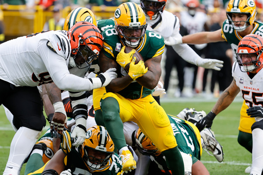 Green Bay Packers running back Josh Jacobs (8) scores a touchdown against the Cincinnati Bengals in the first half of an NFL football game, Sunday, Oct. 12, 2025, in Green Bay, Wis. (AP Photo/Mike Roemer) Green Bay Packers running back Josh Jacobs (8) scores a touchdown against the Cincinnati Bengals in the first half of an NFL football game, Sunday, Oct. 12, 2025, in Green Bay, Wis. (AP Photo/Mike Roemer)