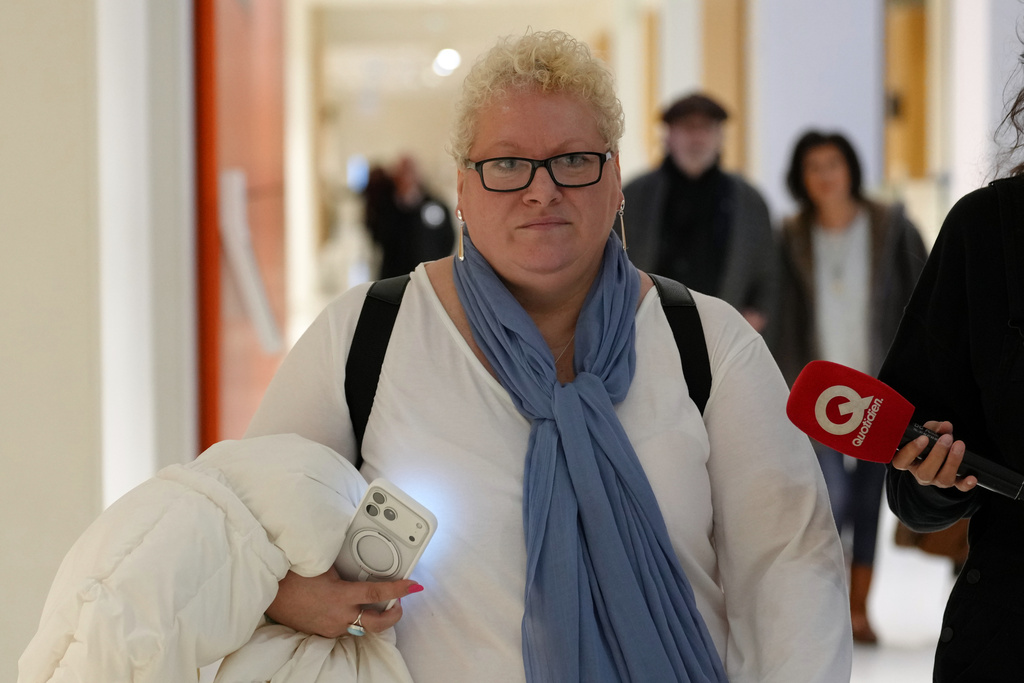 Defendant Delphine Jegousse known as Amandine Roy, arrives at the courtroom for the verdict in a case involving 10 people accused of cyberbullying French first lady Brigitte Macron by spreading false online claims about her gender and sexuality, Monday, Jan. 5, 2026 in Paris. (AP Photo/Aurelien Morissard)