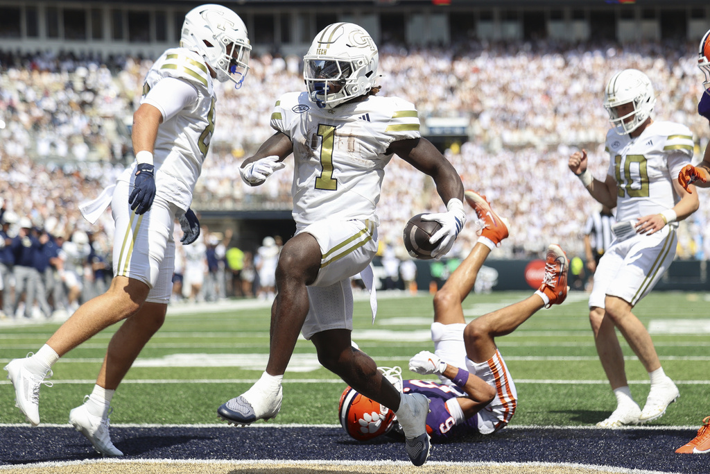 Georgia Tech running back Jamal Haynes (1) scores a touchdown during the first half of an NCAA college football game against Clemson, Saturday, Sept. 13, 2025, in Atlanta. (AP Photo/Colin Hubbard)