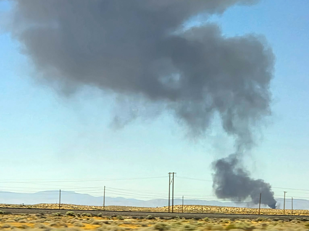 Smoke plumes rise from a B-52 bomber that crashed shortly after takeoff at a U.S. Air Force base in Southern California, Monday, June 15, 2026. (Debbie Reyes Katz via AP Photo)