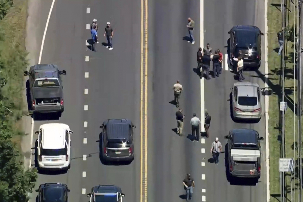 This image taken from video provided by WPVI-TV/6ABC shows law enforcement responding to the scene where, according to police, an ICE officer was struck by a vehicle Monday, June 15, 2026, in Stafford Township, N. (WPVI-TV/6ABC via AP)
