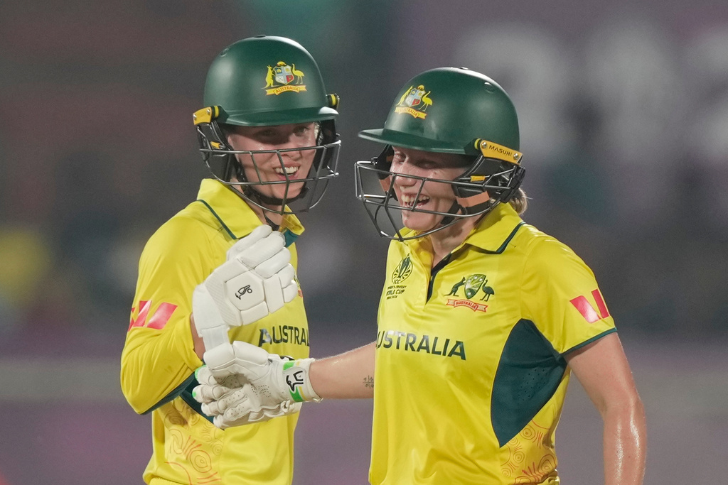 Australia's captain Alyssa Healy ,right, celebrates with batting partner Phoebe Litchfield after scoring fifty runs during the ICC Women's Cricket World Cup match between Australia and Bangladesh at ACA–VDCA Cricket Stadium in Visakhapatnam, India, Thursday, Oct. 16, 2025. (AP Photo/Mahesh Kumar A.)