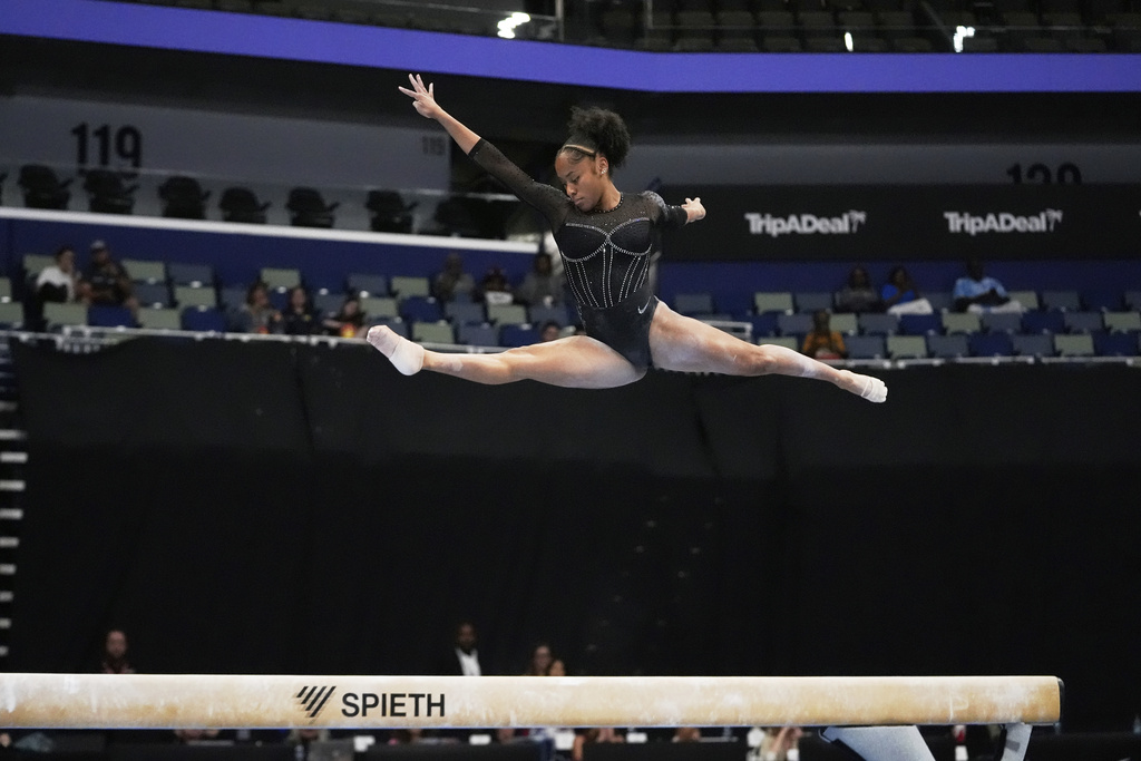 Skye Blakely of the University of Florida competes on the balance beam during the senior women's finals of the U.S. Gymnastics Championships in New Orleans, Sunday, Aug. 10, 2025. (AP Photo/Gerald Herbert)
