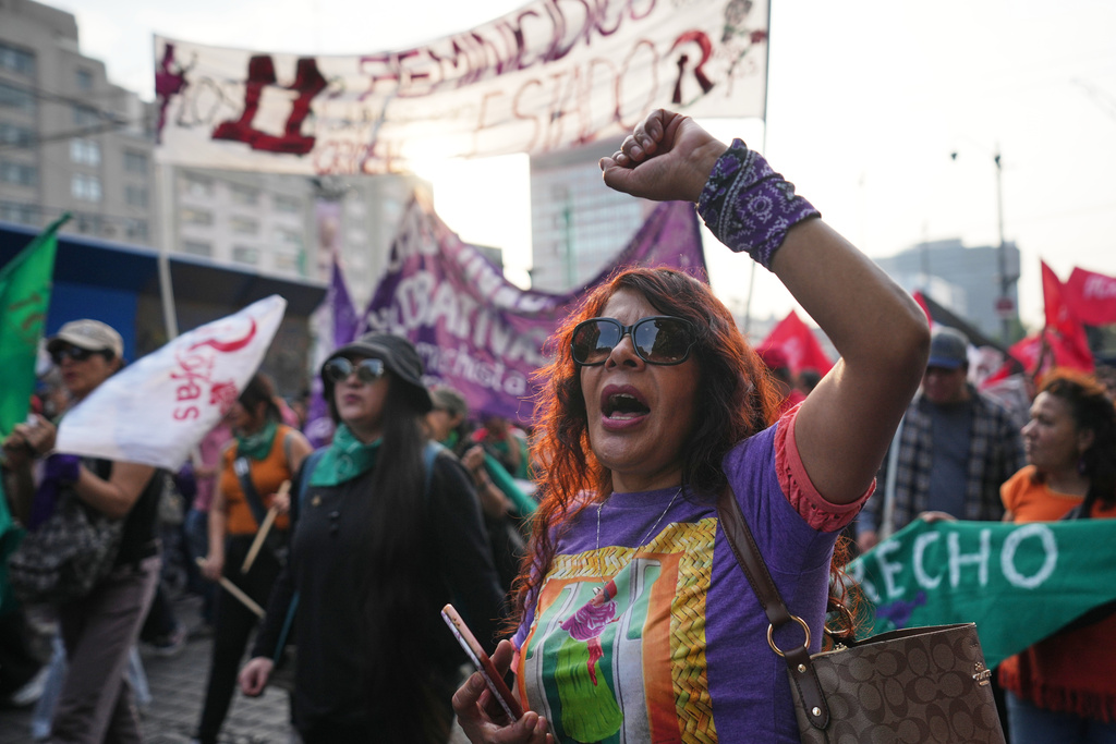 Demonstrators attend a protest marking International Day for the Elimination of Violence Against Women in Mexico City, Tuesday, Nov. 25, 2025. (AP Photo/Claudia Rosel)