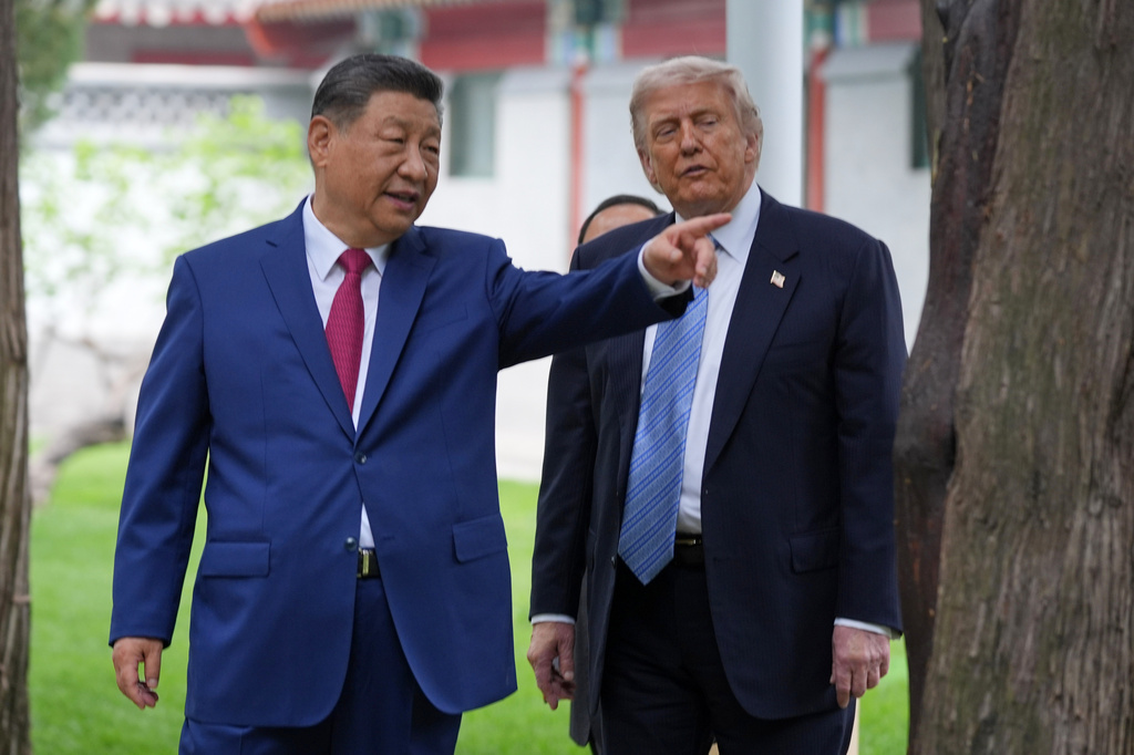 FILE - President Donald Trump talks with China's President Xi Jinping at the Zhongnanhai leadership compound, May 15, 2026, in Beijing. (AP Photo/Mark Schiefelbein, Pool, File)