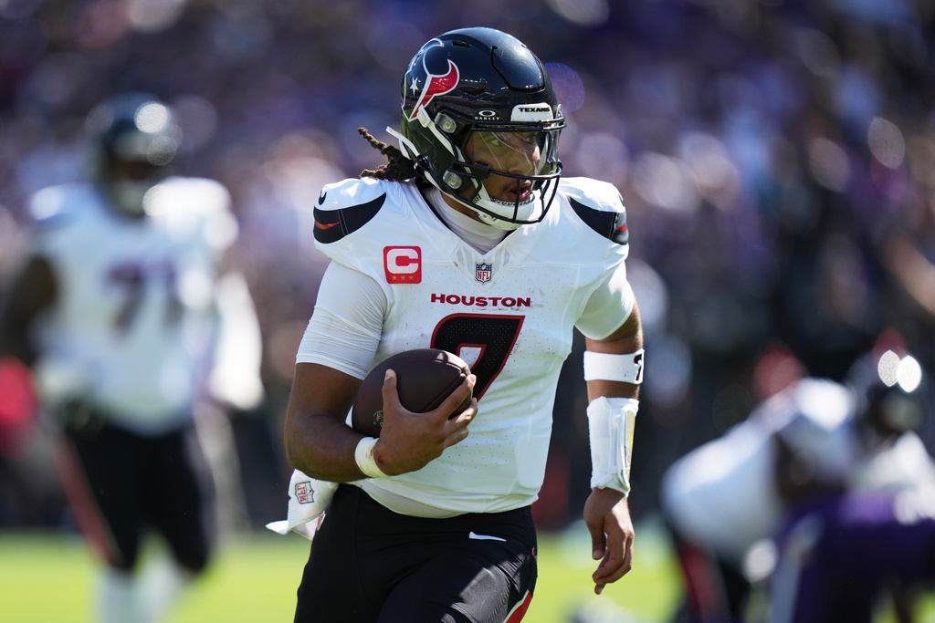 Houston Texans quarterback C.J. Stroud (7) runs the ball during the first half of an NFL football game against the Baltimore Ravens, Sunday, Oct. 5, 2025, in Baltimore. (AP Photo/Stephanie Scarbrough)