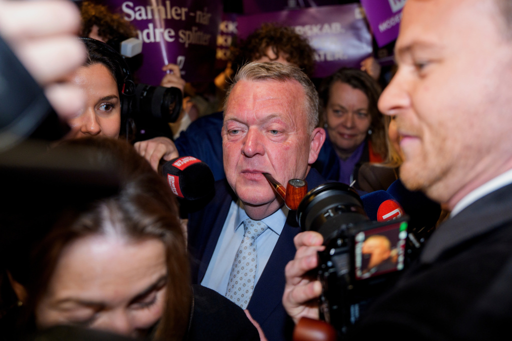 Foreign Minister Lars Løkke Rasmussen, center, leader of the Moderates, arrives at the party's election party for the 2026 Parliamentary Election at Pakhus 11, in the Oesterbro area of Copenhagen, Denmark, Tuesday, March 24, 2026. (Rasmus Flindt Pedersen/Ritzau Scanpix via AP)