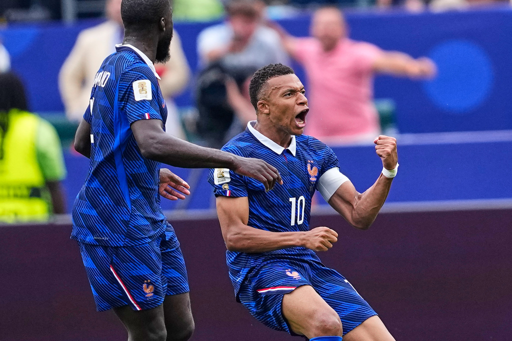 France's Kylian Mbappe (10) celebrates after scoring his team's first goal during the World Cup Group I soccer match between France and Iraq in Philadelphia, Monday, June 22, 2026. (AP Photo/Petr David Josek)