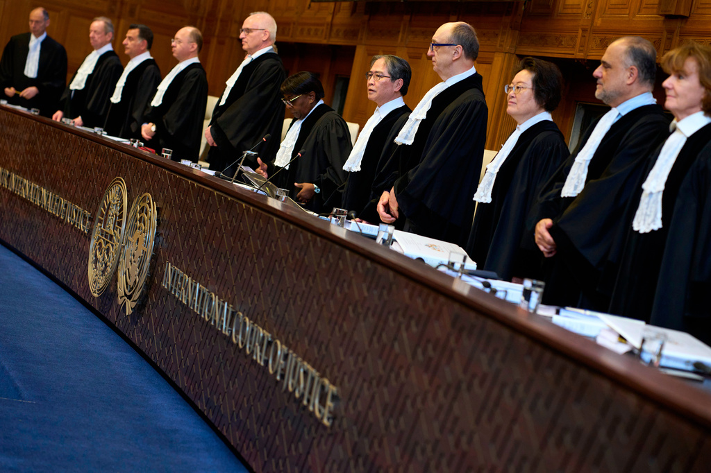 Presiding Judge Yuji Iwasawa, fifth right, opens the court session of the International Court of Justice for a week of hearings in a border dispute dating back to the end of the 19th century between Guyana and Venezuela, in The Hague, Netherlands, Monday, May 4, 2026. (AP Photo/Peter Dejong)