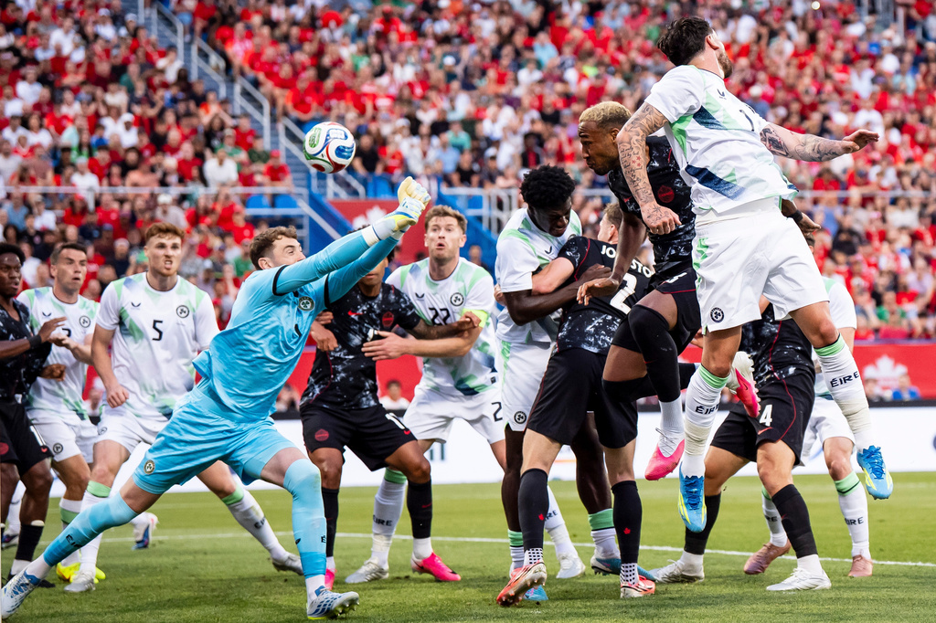 Ireland's Jake O'Brien (7) heads the ball into his own net on a corner kick by Canada's Liam Millar (11) during first half of an International Friendly soccer match in Montreal, on Friday, June 5, 2026. (Christopher Katsarov/The Canadian Press via AP). CORRECTION: Corrects player heading the ball to Jake O'Brien, instead of Kevin O'Toole