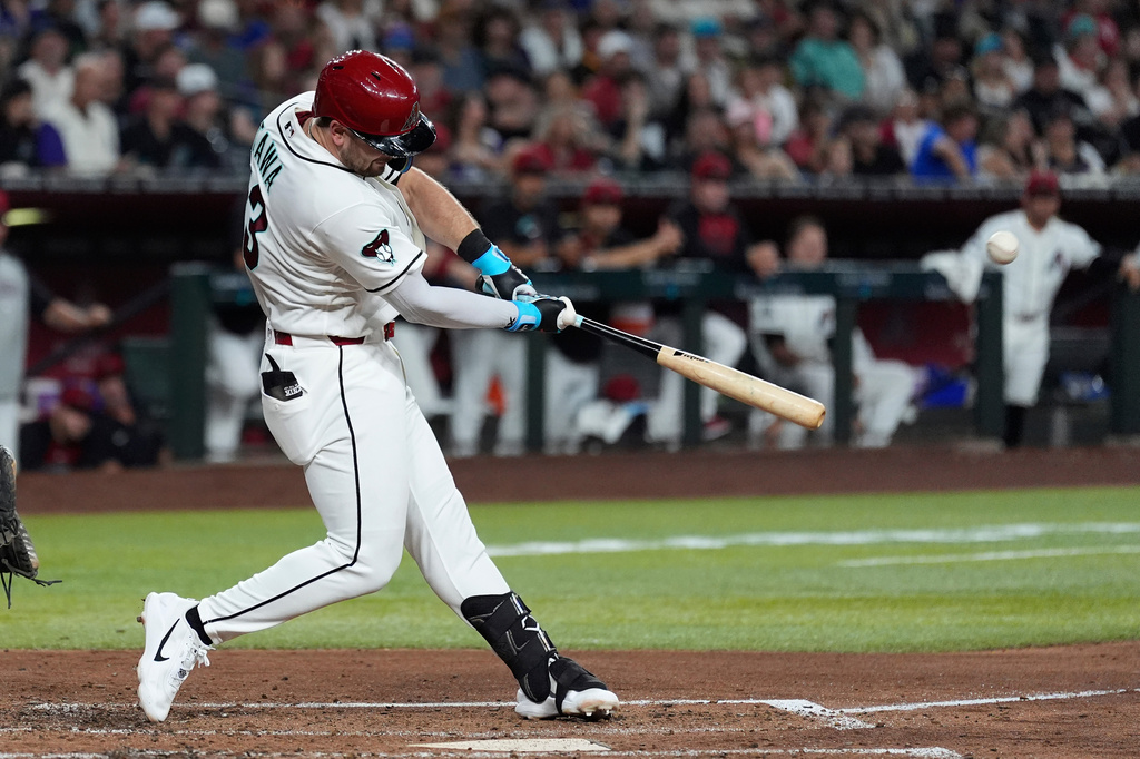 Arizona Diamondbacks' Tim Tawa connects for a three-run home run against the San Diego Padres during the fourth inning of a baseball game, Monday, Aug. 3, 2026, in Phoenix. (AP Photo/Ross D. Franklin)