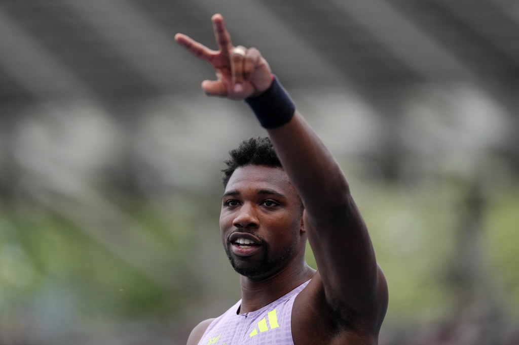 Noah Lyles, of the United States, gestures after finishing second in the men's 100 meters at the Meeting de Paris Diamond League athletics meet in Paris, Sunday, June 28, 2026. (AP Photo/Aurelien Morissard)